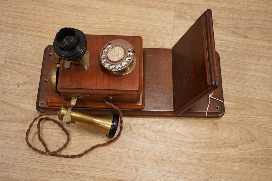 A 1920s walnut wall mounted GPO Model 121 telephone, Patent no.178938. Condition - good.